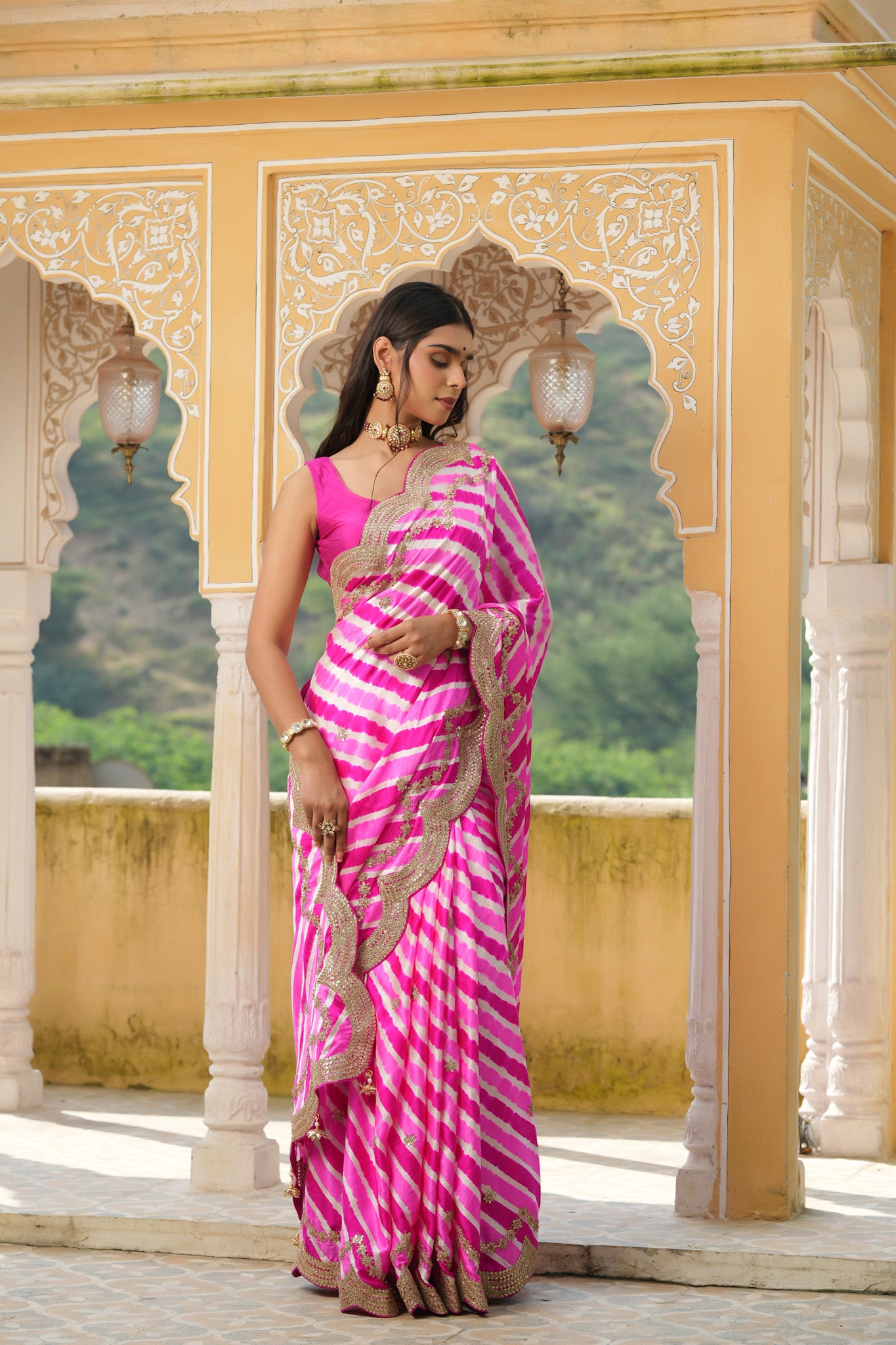 Shop pink striped tussar silk sari online in USA with embroidered scalloped border. Make a fashion statement at weddings with stunning designer sarees, embroidered sarees with blouse, wedding sarees, handloom sarees from Pure Elegance Indian fashion store in USA.-side