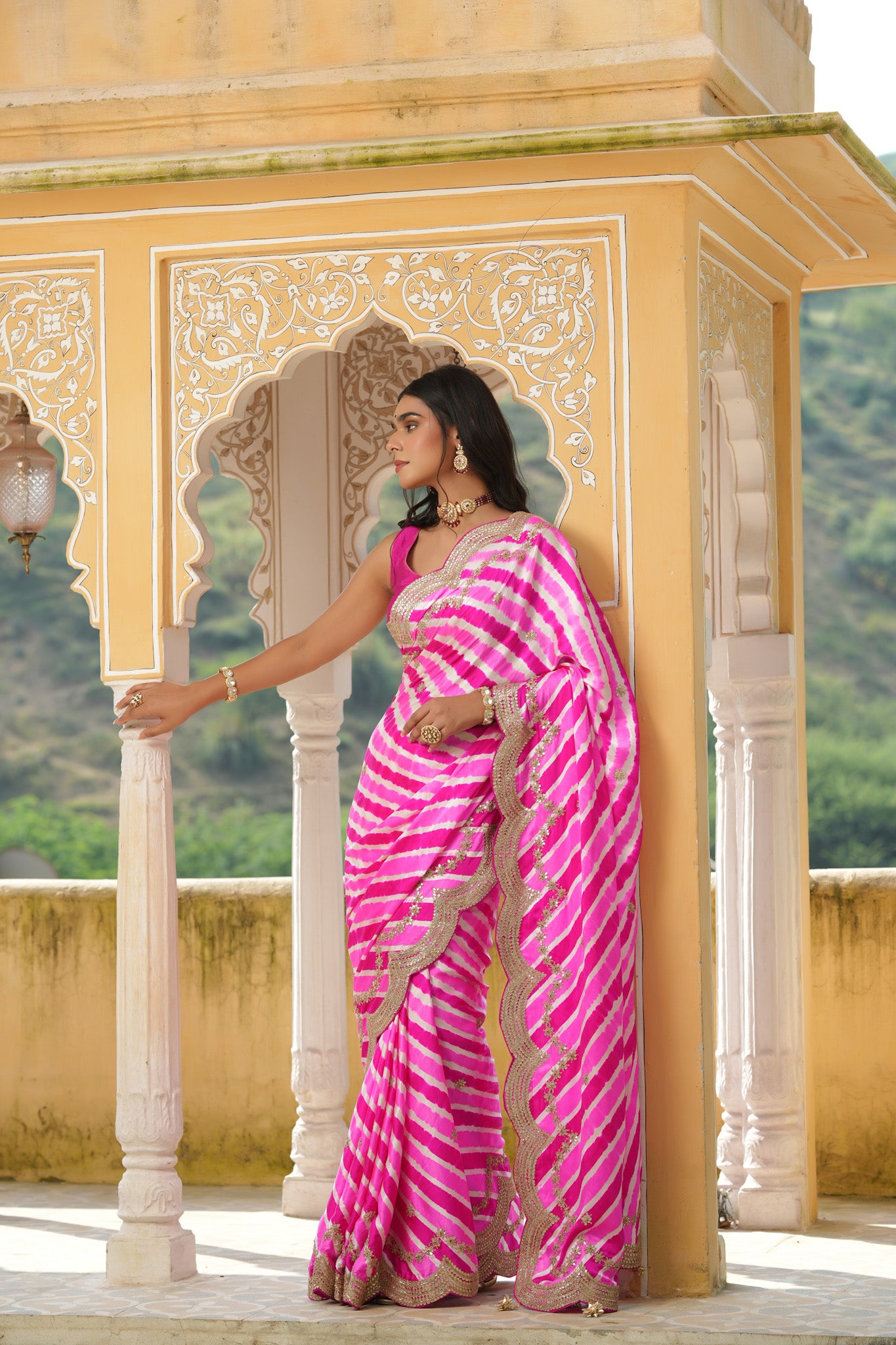 Shop pink striped tussar silk sari online in USA with embroidered scalloped border. Make a fashion statement at weddings with stunning designer sarees, embroidered sarees with blouse, wedding sarees, handloom sarees from Pure Elegance Indian fashion store in USA.-front