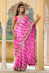 Shop pink striped tussar silk sari online in USA with embroidered scalloped border. Make a fashion statement at weddings with stunning designer sarees, embroidered sarees with blouse, wedding sarees, handloom sarees from Pure Elegance Indian fashion store in USA.-full view