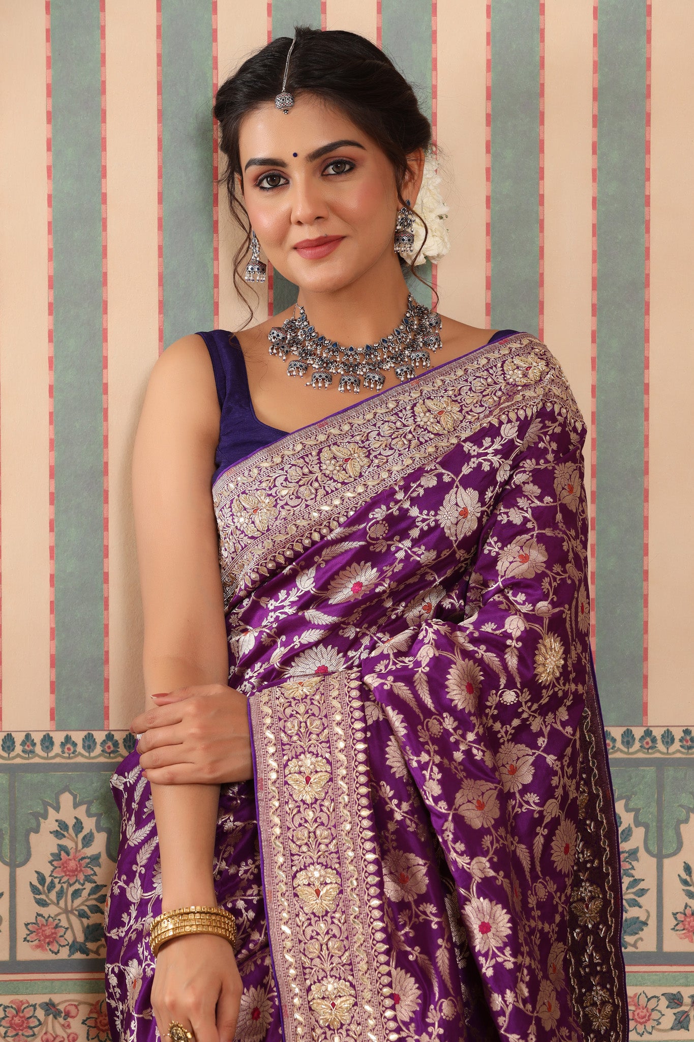 Buy purple heavy Banarasi sari online in USA with zari minakari work. Make a fashion statement at weddings with stunning designer sarees, embroidered sarees with blouse, wedding sarees, handloom sarees from Pure Elegance Indian fashion store in USA.-closeup