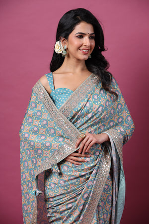 Shop beautiful sea green printed mulberry silk sari online in USA with embroidered border. Make a fashion statement at weddings with stunning designer sarees, embroidered sarees with blouse, wedding sarees, handloom sarees from Pure Elegance Indian fashion store in USA.-closeup