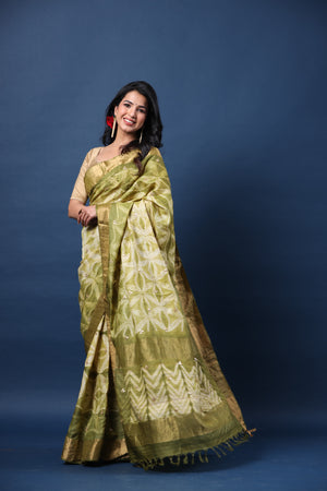 Buy olive green printed tussar silk sari online in USA with golden zari border. Make a fashion statement at weddings with stunning designer sarees, embroidered sarees with blouse, wedding sarees, handloom sarees from Pure Elegance Indian fashion store in USA.-pallu
