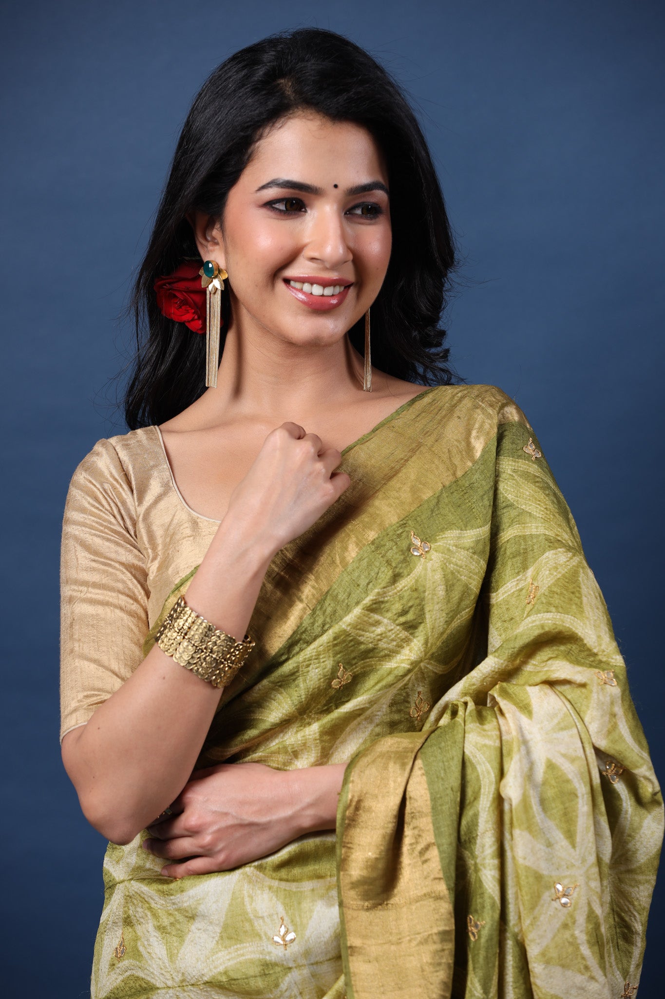 Buy olive green printed tussar silk sari online in USA with golden zari border. Make a fashion statement at weddings with stunning designer sarees, embroidered sarees with blouse, wedding sarees, handloom sarees from Pure Elegance Indian fashion store in USA.-closeup