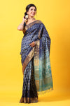 Shop blue printed tussar silk sari online in USA with zari border. Make a fashion statement at weddings with stunning designer sarees, embroidered sarees with blouse, wedding sarees, handloom sarees from Pure Elegance Indian fashion store in USA.-front