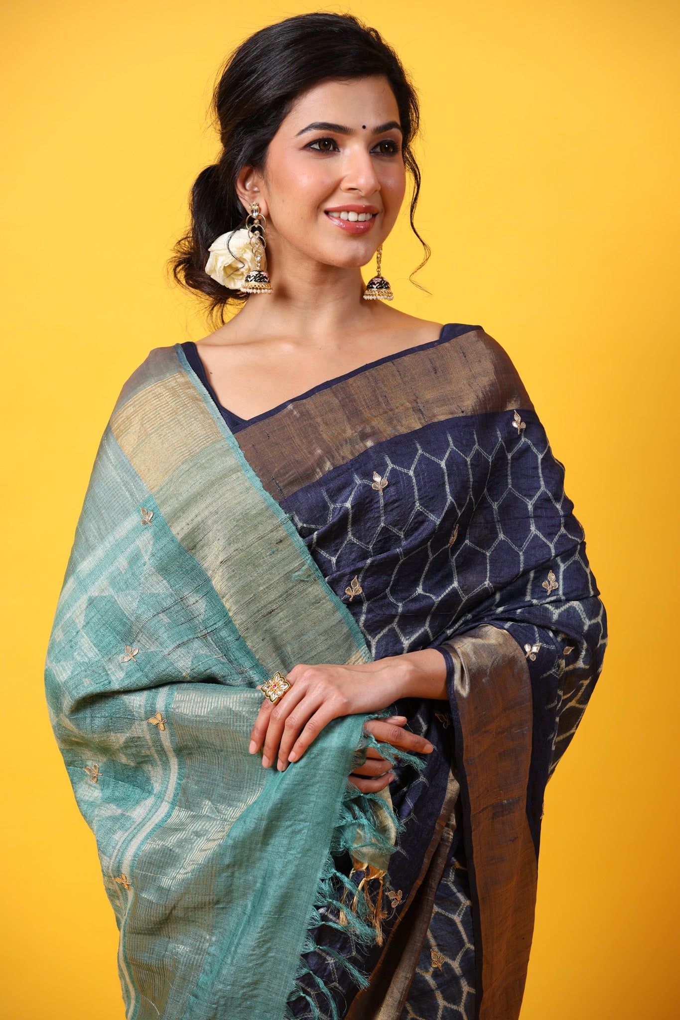 Shop blue printed tussar silk sari online in USA with zari border. Make a fashion statement at weddings with stunning designer sarees, embroidered sarees with blouse, wedding sarees, handloom sarees from Pure Elegance Indian fashion store in USA.-closeup