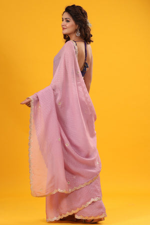 Shop light pink organza sari online in USA with scalloped border. Make a fashion statement at weddings with stunning designer sarees, embroidered sarees with blouse, wedding sarees, handloom sarees from Pure Elegance Indian fashion store in USA.-back
