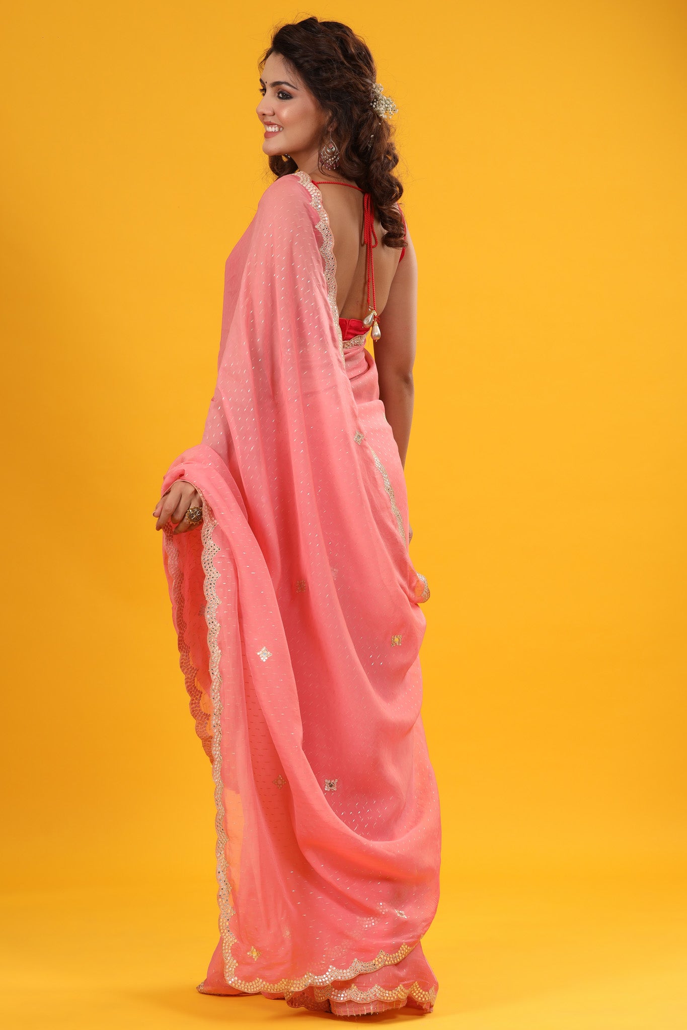 Buy pink organza sari online in USA with embroidered scalloped border. Make a fashion statement at weddings with stunning designer sarees, embroidered sarees with blouse, wedding sarees, handloom sarees from Pure Elegance Indian fashion store in USA.-back