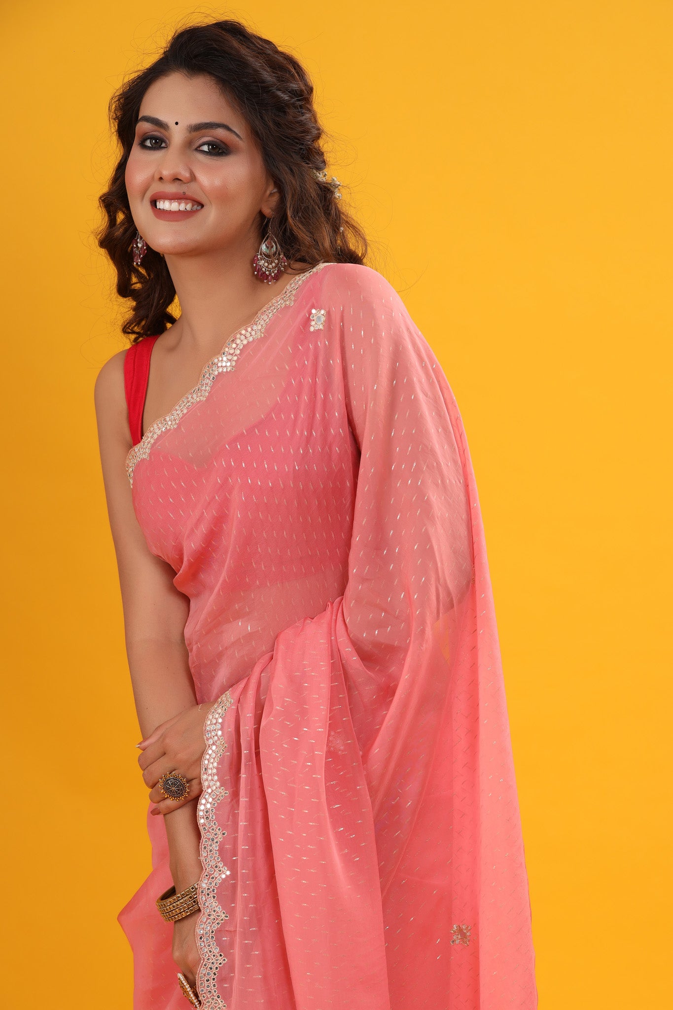Buy pink organza sari online in USA with embroidered scalloped border. Make a fashion statement at weddings with stunning designer sarees, embroidered sarees with blouse, wedding sarees, handloom sarees from Pure Elegance Indian fashion store in USA.-closeup