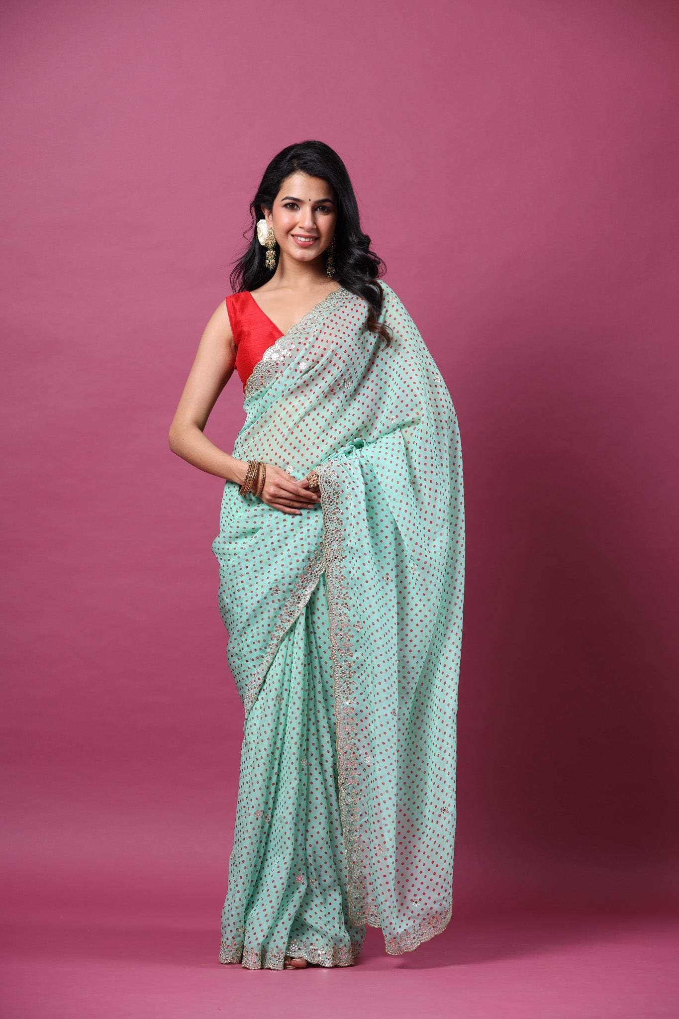 Buy mint green bandhej organza sari online in USA with scalloped border. Make a fashion statement at weddings with stunning designer sarees, embroidered sarees with blouse, wedding sarees, handloom sarees from Pure Elegance Indian fashion store in USA.-front