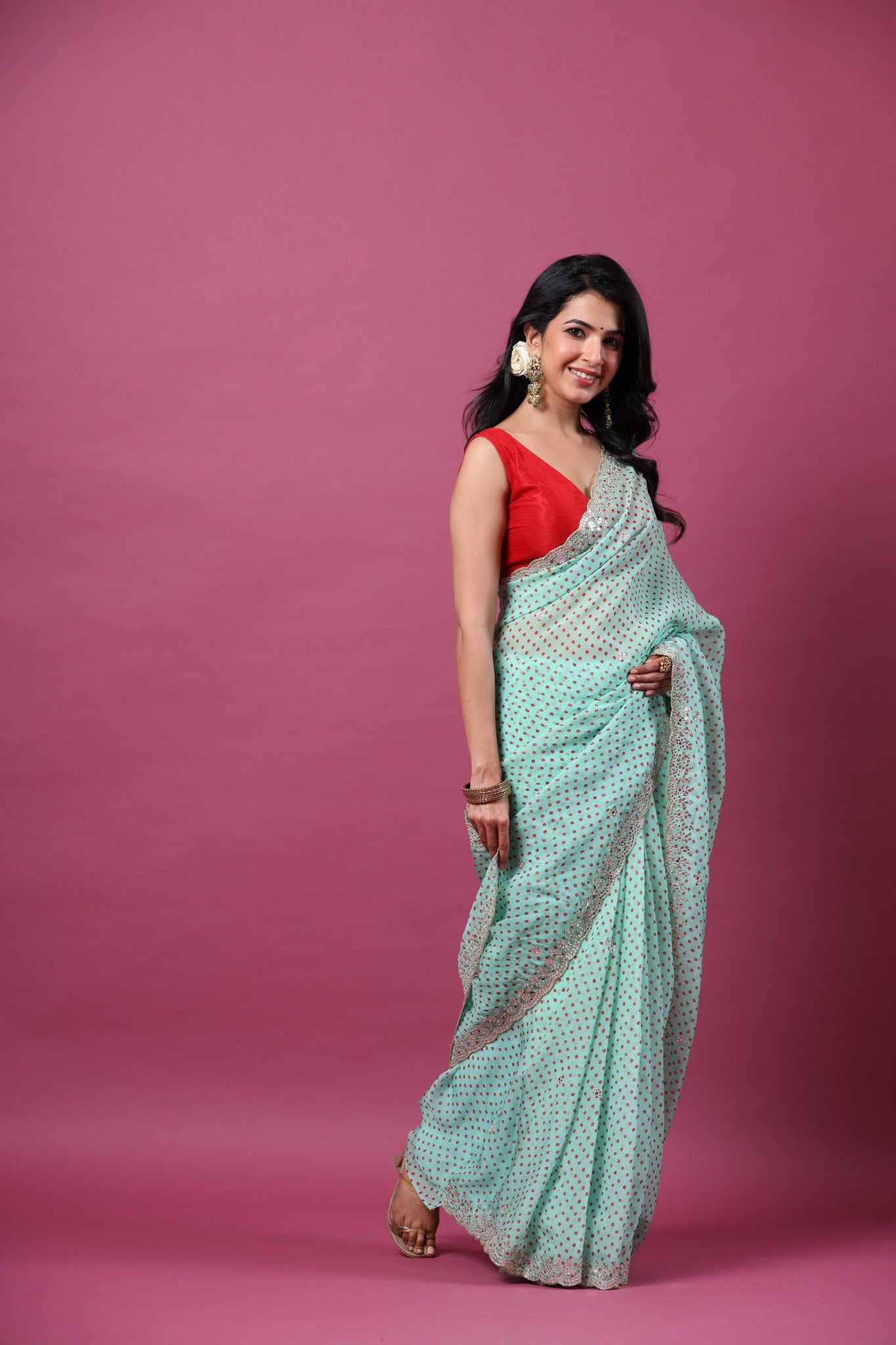 Buy mint green bandhej organza sari online in USA with scalloped border. Make a fashion statement at weddings with stunning designer sarees, embroidered sarees with blouse, wedding sarees, handloom sarees from Pure Elegance Indian fashion store in USA.-side