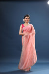 Buy powder pink bandhej organza sari online in USA with scalloped border. Make a fashion statement at weddings with stunning designer sarees, embroidered sarees with blouse, wedding sarees, handloom sarees from Pure Elegance Indian fashion store in USA.-full view
