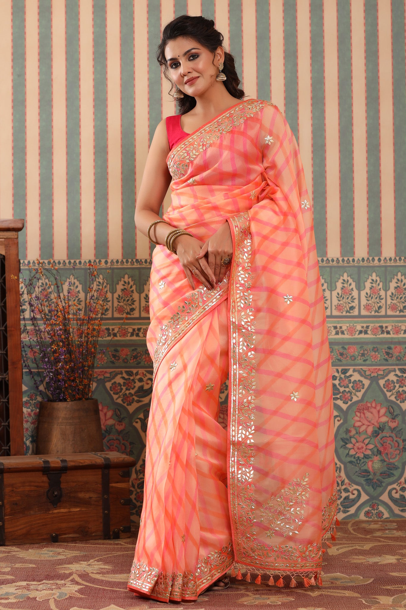 Buy beautiful peach organza sari online in USA with gota patti border. Make a fashion statement at weddings with stunning designer sarees, embroidered sarees with blouse, wedding sarees, handloom sarees from Pure Elegance Indian fashion store in USA.-front