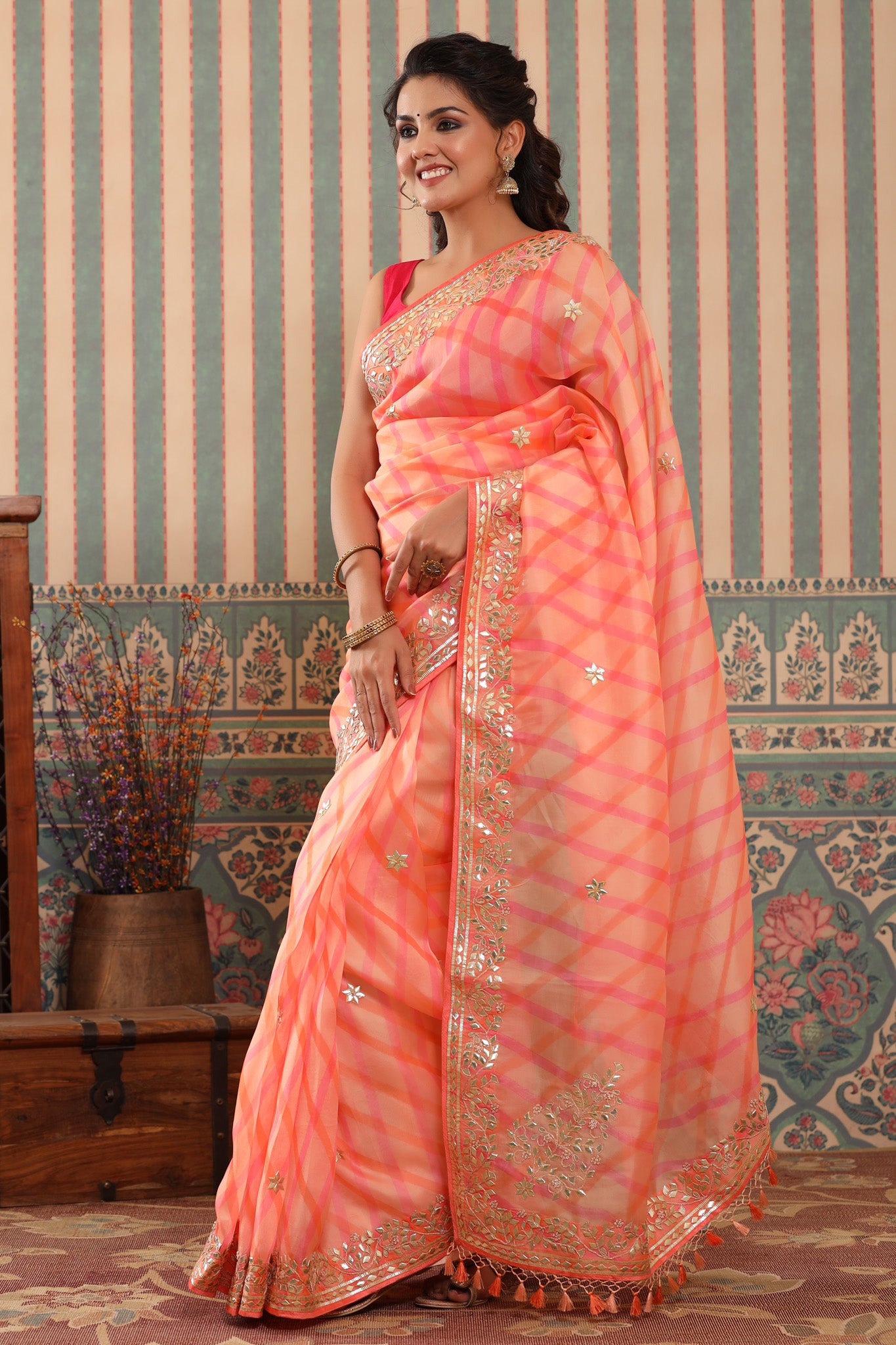 Buy beautiful peach organza sari online in USA with gota patti border. Make a fashion statement at weddings with stunning designer sarees, embroidered sarees with blouse, wedding sarees, handloom sarees from Pure Elegance Indian fashion store in USA.-pallu