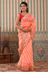 Buy beautiful peach organza sari online in USA with gota patti border. Make a fashion statement at weddings with stunning designer sarees, embroidered sarees with blouse, wedding sarees, handloom sarees from Pure Elegance Indian fashion store in USA.-full view