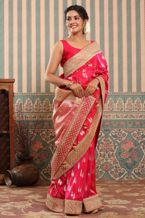 Shop bright pink Banarasi saree online in USA with embroidered border. Make a fashion statement at weddings with stunning designer sarees, embroidered sarees with blouse, wedding sarees, handloom sarees from Pure Elegance Indian fashion store in USA.-side