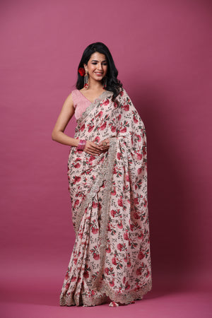 Buy powder pink floral georgette saree online in USA with scalloped border. Make a fashion statement at weddings with stunning designer sarees, embroidered sarees with blouse, wedding sarees, handloom sarees from Pure Elegance Indian fashion store in USA.-front