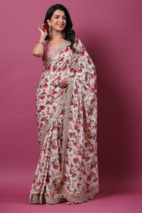 Buy powder pink floral georgette saree online in USA with scalloped border. Make a fashion statement at weddings with stunning designer sarees, embroidered sarees with blouse, wedding sarees, handloom sarees from Pure Elegance Indian fashion store in USA.-full view