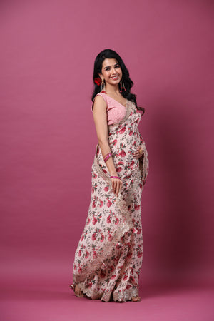 Buy powder pink floral georgette saree online in USA with scalloped border. Make a fashion statement at weddings with stunning designer sarees, embroidered sarees with blouse, wedding sarees, handloom sarees from Pure Elegance Indian fashion store in USA.-side