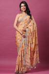 Shop yellow floral georgette saree online in USA with scalloped border. Make a fashion statement at weddings with stunning designer sarees, embroidered sarees with blouse, wedding sarees, handloom sarees from Pure Elegance Indian fashion store in USA.-full view