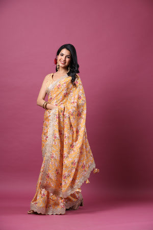 Shop yellow floral georgette saree online in USA with scalloped border. Make a fashion statement at weddings with stunning designer sarees, embroidered sarees with blouse, wedding sarees, handloom sarees from Pure Elegance Indian fashion store in USA.-pallu