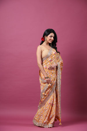 Shop yellow floral georgette saree online in USA with scalloped border. Make a fashion statement at weddings with stunning designer sarees, embroidered sarees with blouse, wedding sarees, handloom sarees from Pure Elegance Indian fashion store in USA.-side