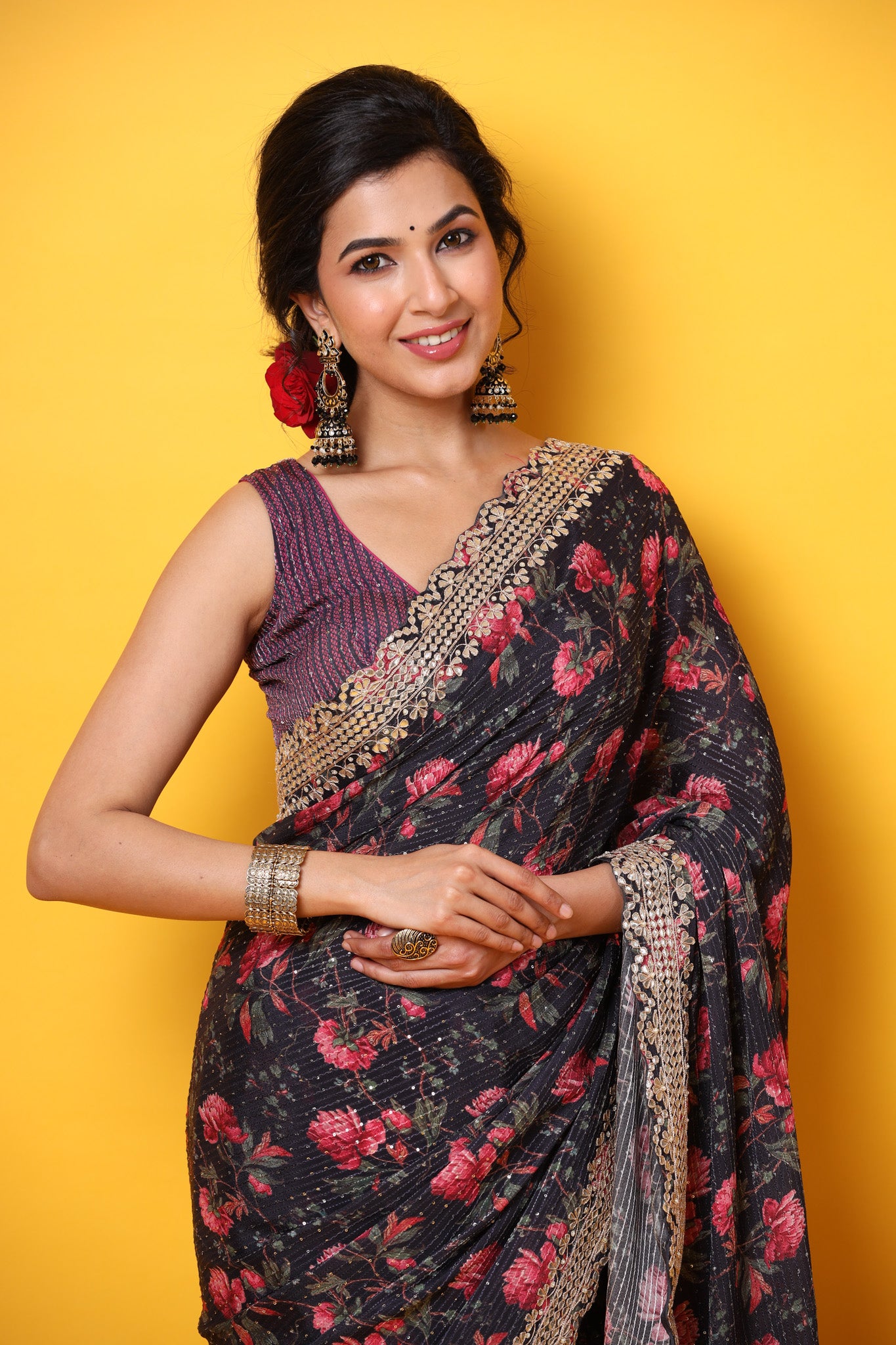 Buy black floral georgette saree online in USA with scalloped border. Make a fashion statement at weddings with stunning designer sarees, embroidered sarees with blouse, wedding sarees, handloom sarees from Pure Elegance Indian fashion store in USA.-closeup