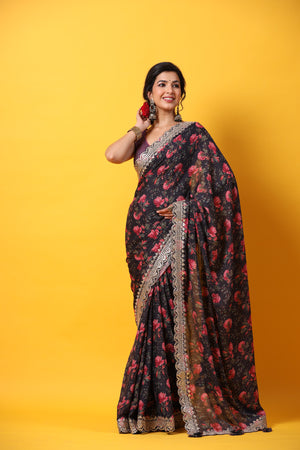 Buy black floral georgette saree online in USA with scalloped border. Make a fashion statement at weddings with stunning designer sarees, embroidered sarees with blouse, wedding sarees, handloom sarees from Pure Elegance Indian fashion store in USA.-saree