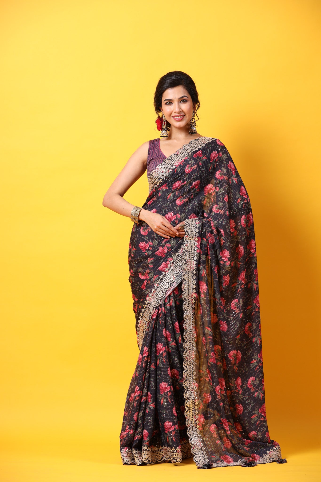 Buy black floral georgette saree online in USA with scalloped border. Make a fashion statement at weddings with stunning designer sarees, embroidered sarees with blouse, wedding sarees, handloom sarees from Pure Elegance Indian fashion store in USA.-front