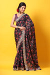 Buy black floral georgette saree online in USA with scalloped border. Make a fashion statement at weddings with stunning designer sarees, embroidered sarees with blouse, wedding sarees, handloom sarees from Pure Elegance Indian fashion store in USA.-full view