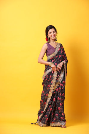 Buy black floral georgette saree online in USA with scalloped border. Make a fashion statement at weddings with stunning designer sarees, embroidered sarees with blouse, wedding sarees, handloom sarees from Pure Elegance Indian fashion store in USA.-side