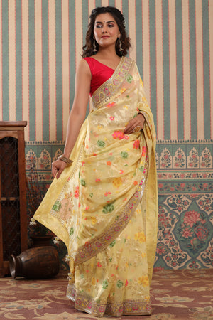 Shop light yellow organza silk saree online in USA with embroidered border. Make a fashion statement at weddings with stunning designer sarees, embroidered sarees with blouse, wedding sarees, handloom sarees from Pure Elegance Indian fashion store in USA.-side