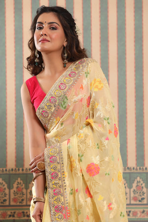 Shop light yellow organza silk saree online in USA with embroidered border. Make a fashion statement at weddings with stunning designer sarees, embroidered sarees with blouse, wedding sarees, handloom sarees from Pure Elegance Indian fashion store in USA.-closeup