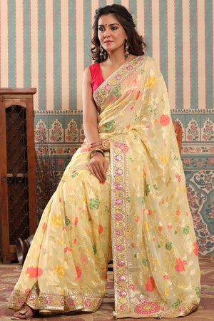 Shop light yellow organza silk saree online in USA with embroidered border. Make a fashion statement at weddings with stunning designer sarees, embroidered sarees with blouse, wedding sarees, handloom sarees from Pure Elegance Indian fashion store in USA.-pallu