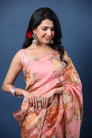 Buy light pink embroidered floral organza silk saree online in USA with blouse. Make a fashion statement at weddings with stunning designer sarees, embroidered sarees with blouse, wedding sarees, handloom sarees from Pure Elegance Indian fashion store in USA.-closeup