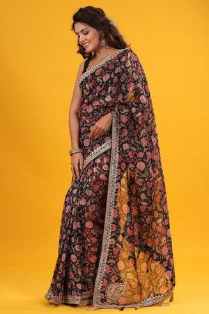Buy black floral georgette saree online in USA with embroidered border. Make a fashion statement at weddings with stunning designer sarees, embroidered sarees with blouse, wedding sarees, handloom sarees from Pure Elegance Indian fashion store in USA.-side
