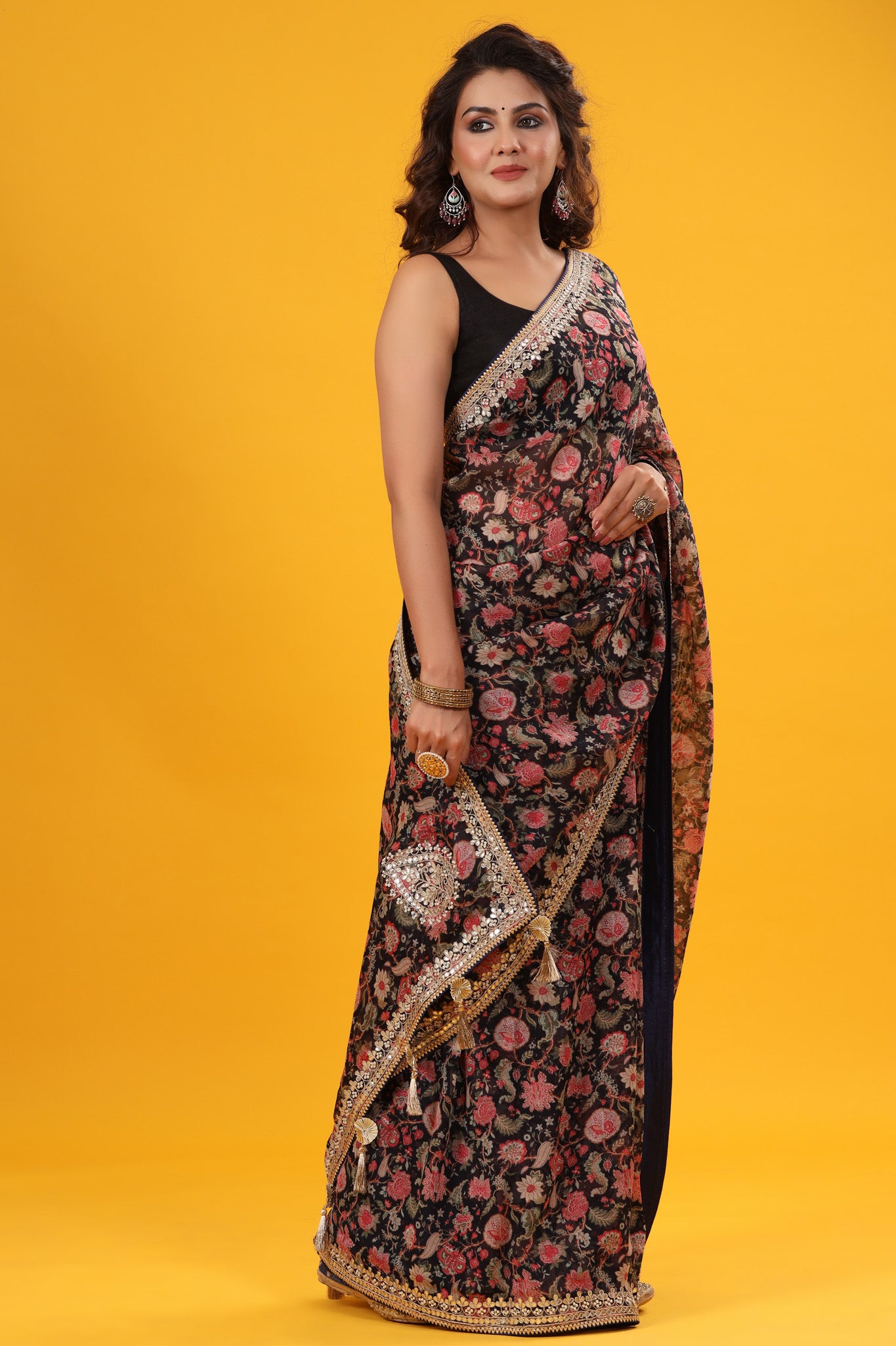 Buy black floral georgette saree online in USA with embroidered border. Make a fashion statement at weddings with stunning designer sarees, embroidered sarees with blouse, wedding sarees, handloom sarees from Pure Elegance Indian fashion store in USA.-full view
