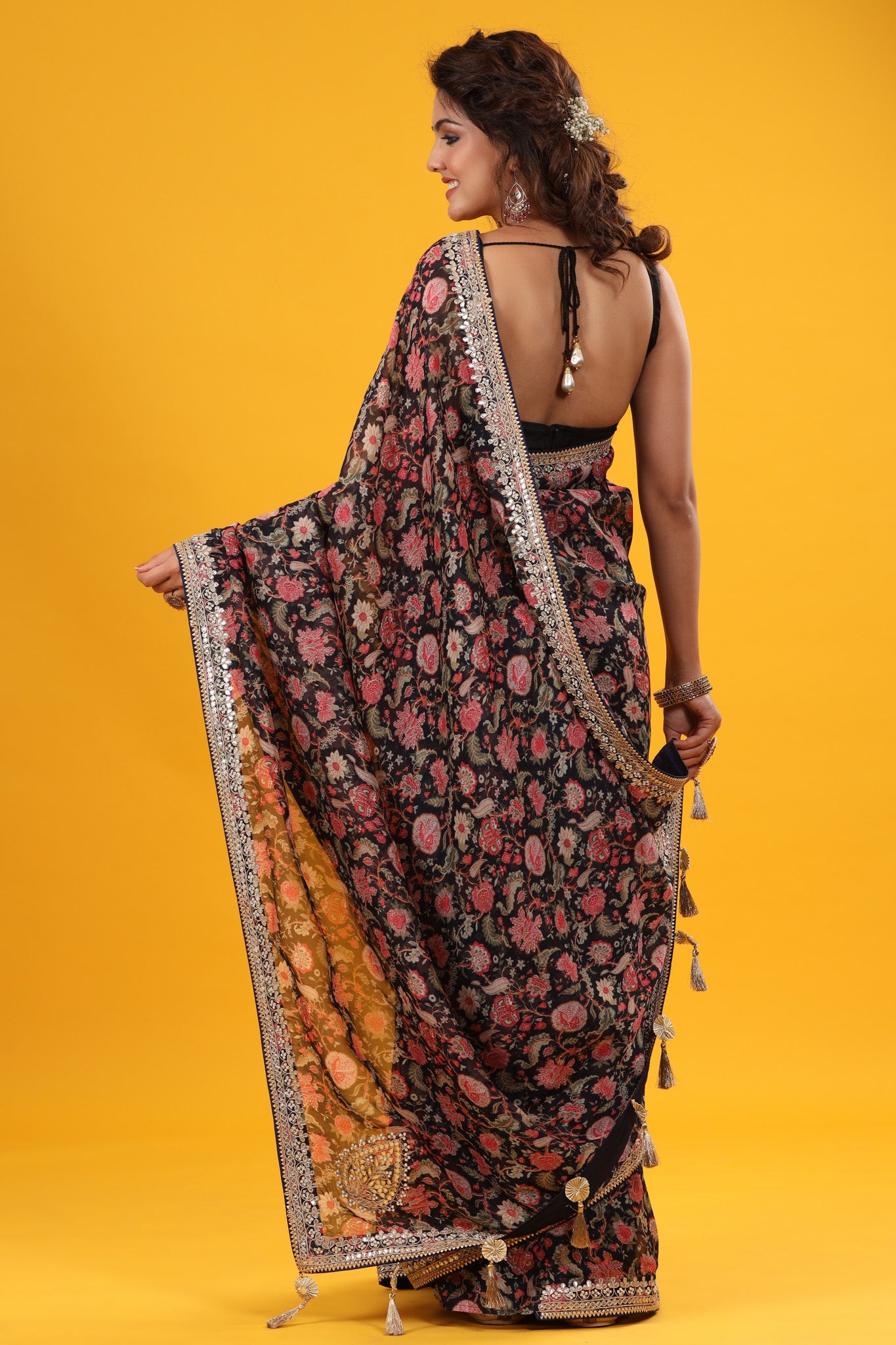 Buy black floral georgette saree online in USA with embroidered border. Make a fashion statement at weddings with stunning designer sarees, embroidered sarees with blouse, wedding sarees, handloom sarees from Pure Elegance Indian fashion store in USA.-back