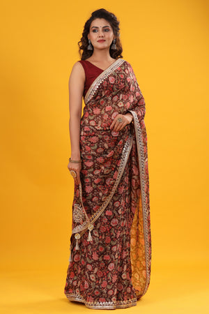 Shop beautiful maroon floral georgette saree online in USA with embroidered border. Make a fashion statement at weddings with stunning designer sarees, embroidered sarees with blouse, wedding sarees, handloom sarees from Pure Elegance Indian fashion store in USA.-side