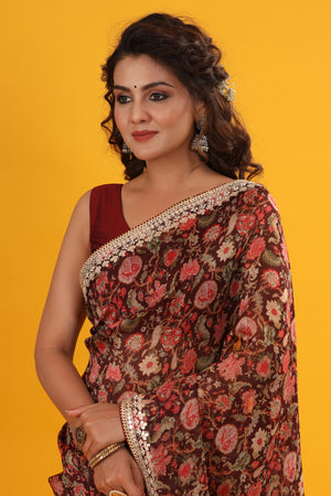 Shop beautiful maroon floral georgette saree online in USA with embroidered border. Make a fashion statement at weddings with stunning designer sarees, embroidered sarees with blouse, wedding sarees, handloom sarees from Pure Elegance Indian fashion store in USA.-closeup