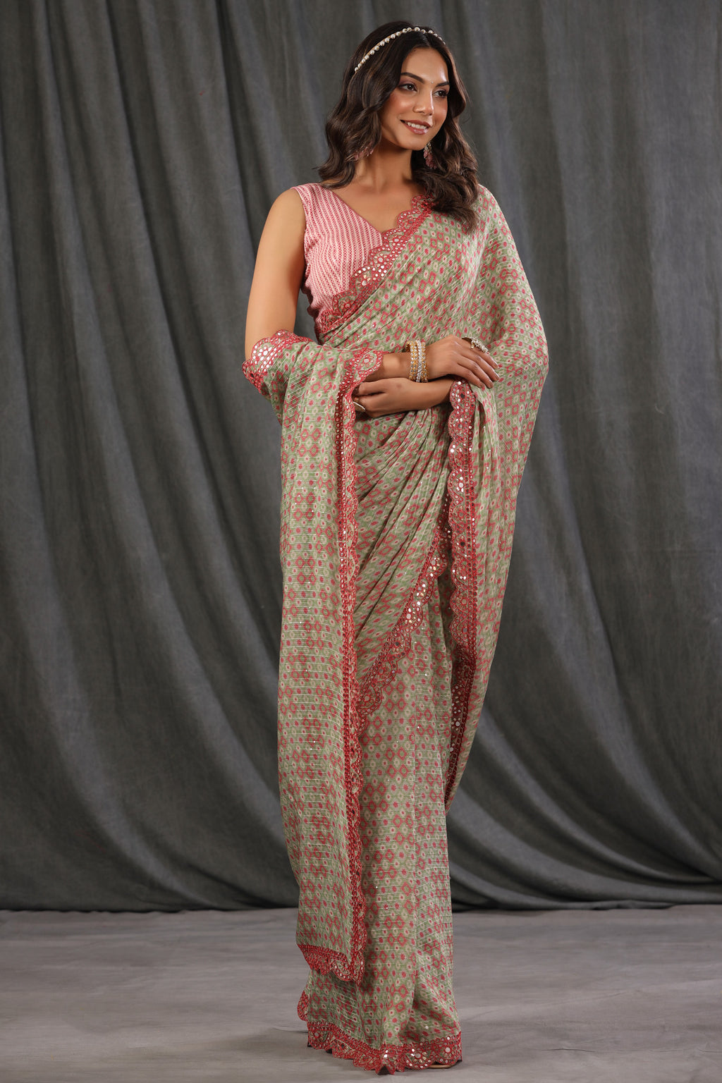 Shop pink green printed georgette saree online in USA with scalloped border. Make a fashion statement at weddings with stunning designer sarees, embroidered sarees with blouse, wedding sarees, handloom sarees from Pure Elegance Indian fashion store in USA.-full view
