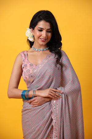 Buy pink blue multicolor printed georgette saree online in USA with scalloped border. Make a fashion statement at weddings with stunning designer sarees, embroidered sarees with blouse, wedding sarees, handloom sarees from Pure Elegance Indian fashion store in USA.-closeup