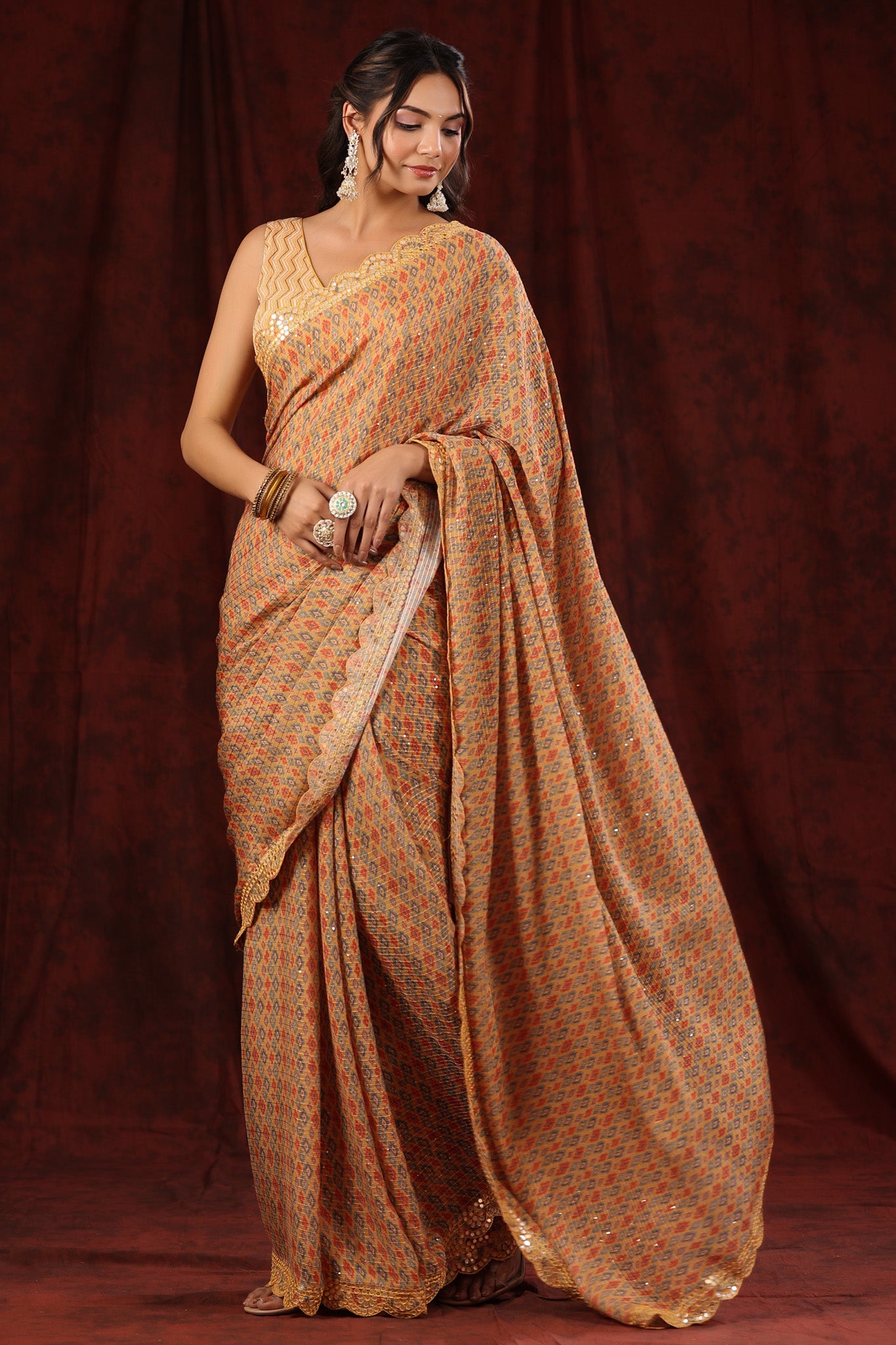 Buy yellow georgette saree online in USA with scalloped border. Make a fashion statement at weddings with stunning designer sarees, embroidered sarees with blouse, wedding sarees, handloom sarees from Pure Elegance Indian fashion store in USA.-front