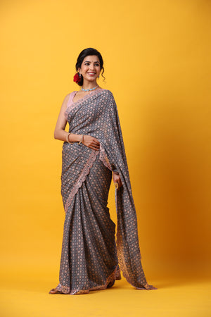 Shop beautiful blue georgette saree online in USA with scalloped border. Make a fashion statement at weddings with stunning designer sarees, embroidered sarees with blouse, wedding sarees, handloom sarees from Pure Elegance Indian fashion store in USA.-pallu