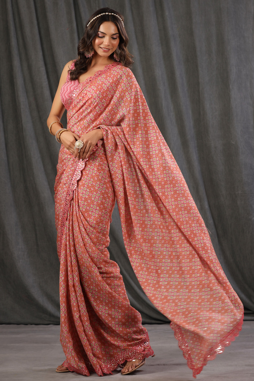 Buy pink printed crepe georgette saree online in USA with scalloped border. Make a fashion statement at weddings with stunning designer sarees, embroidered sarees with blouse, wedding sarees, handloom sarees from Pure Elegance Indian fashion store in USA.-full view