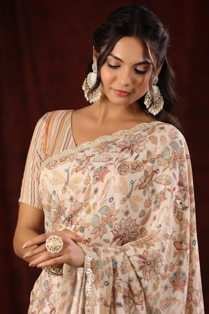 Shop cream floral print embroidered crepe georgette saree online in USA with blouse. Make a fashion statement at weddings with stunning designer sarees, embroidered sarees with blouse, wedding sarees, handloom sarees from Pure Elegance Indian fashion store in USA.-closeup