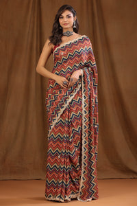 Buy multicolor chevron pattern crepe georgette sari online in USA with embroidered border and blouse. Make a fashion statement at weddings with stunning designer sarees, embroidered sarees with blouse, wedding sarees, handloom sarees from Pure Elegance Indian fashion store in USA.-full view