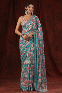 Shop blue floral crepe saree online in USA with embroidered border and blouse. Make a fashion statement at weddings with stunning designer sarees, embroidered sarees with blouse, wedding sarees, handloom sarees from Pure Elegance Indian fashion store in USA.-full view