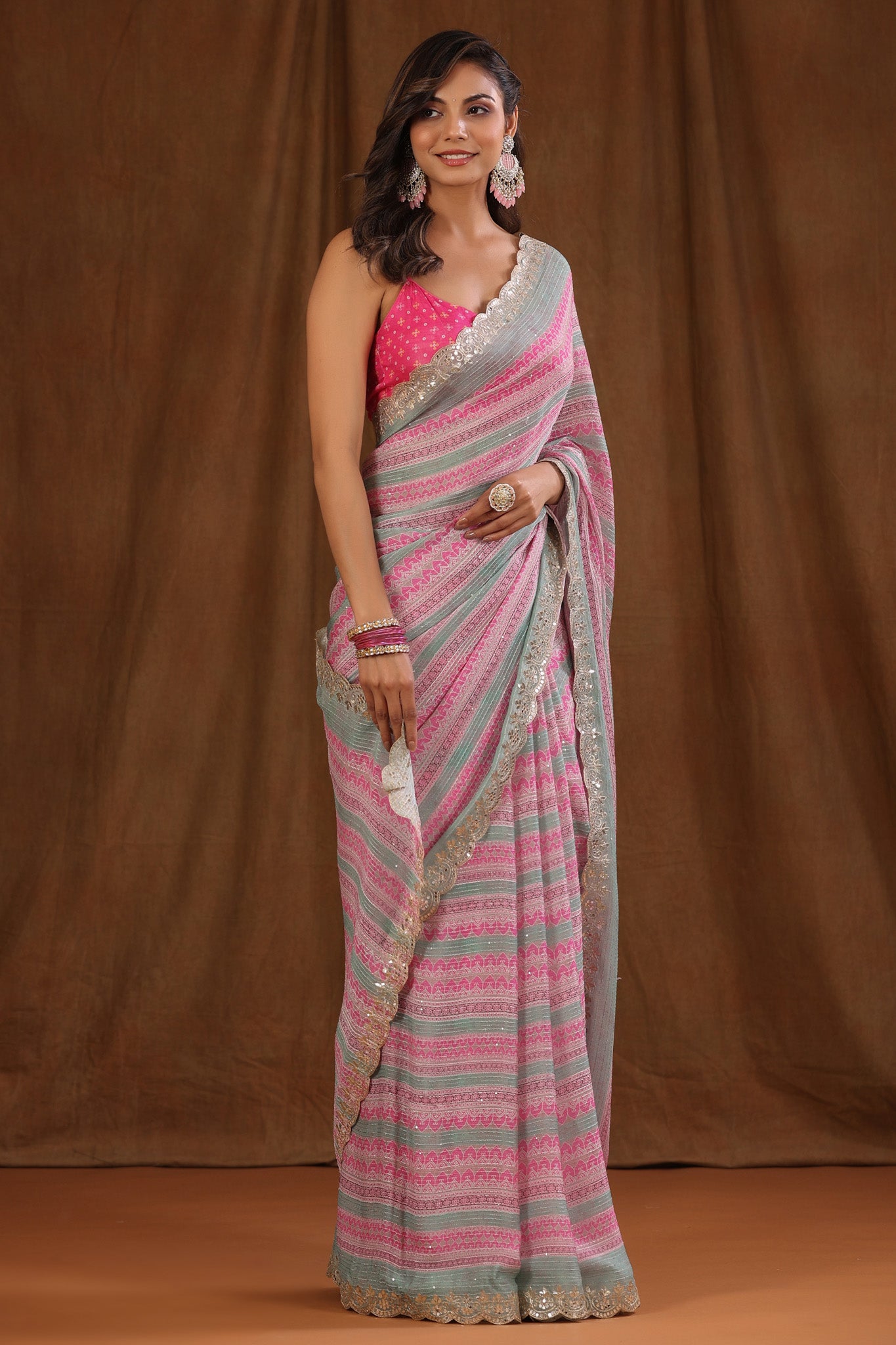 Buy light pink and green crepe saree online in USA with embroidered border and blouse. Make a fashion statement at weddings with stunning designer sarees, embroidered sarees with blouse, wedding sarees, handloom sarees from Pure Elegance Indian fashion store in USA.-front