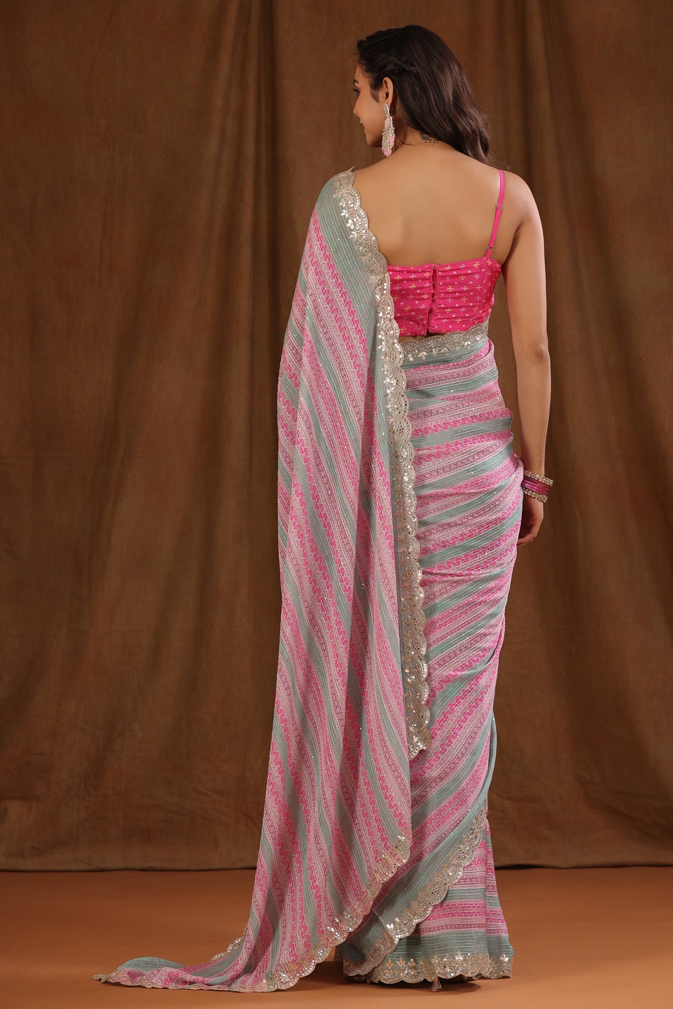 Buy light pink and green crepe saree online in USA with embroidered border and blouse. Make a fashion statement at weddings with stunning designer sarees, embroidered sarees with blouse, wedding sarees, handloom sarees from Pure Elegance Indian fashion store in USA.-back