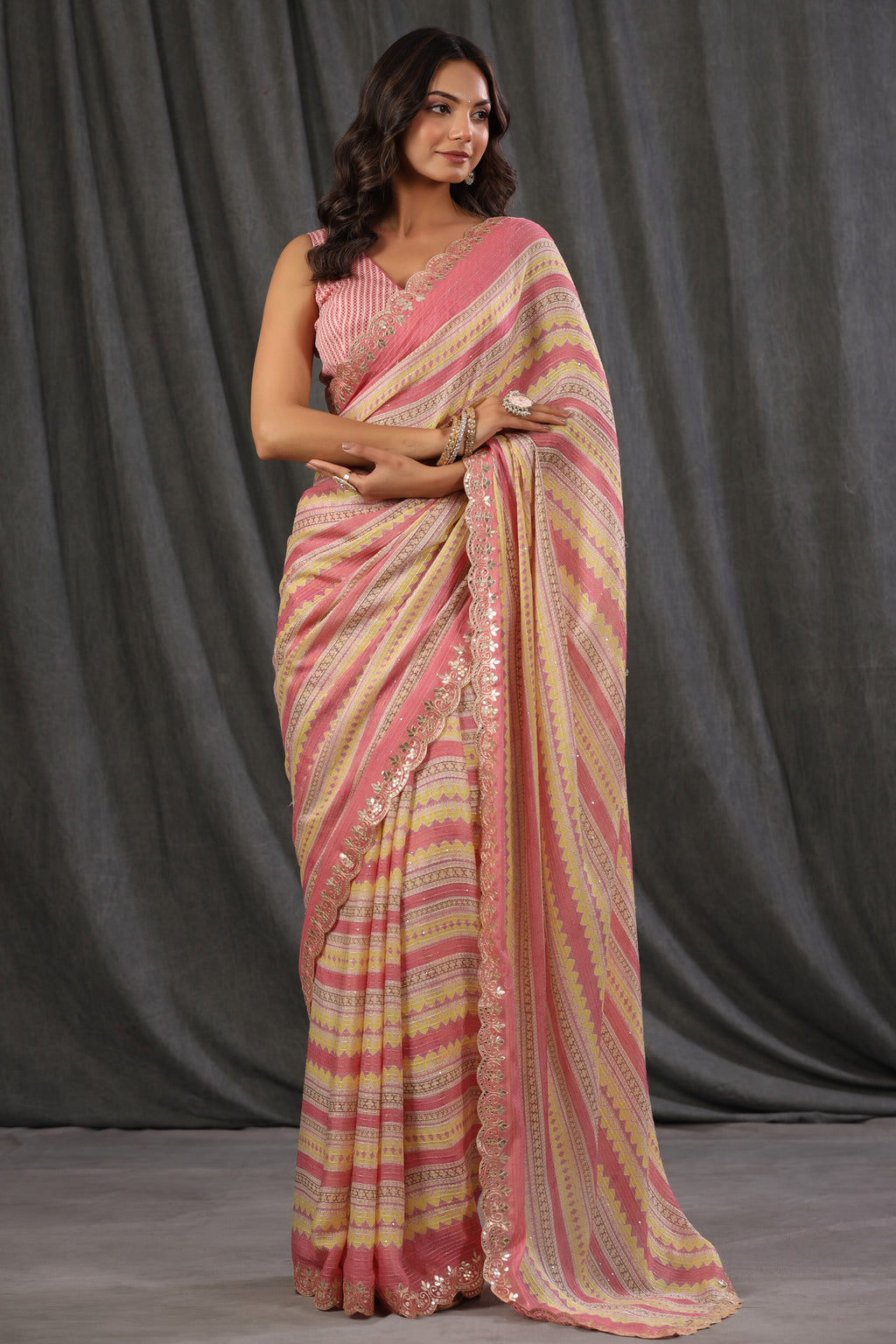 Buy light pink and yellow crepe saree online in USA with embroidered border and blouse. Make a fashion statement at weddings with stunning designer sarees, embroidered sarees with blouse, wedding sarees, handloom sarees from Pure Elegance Indian fashion store in USA.-full view